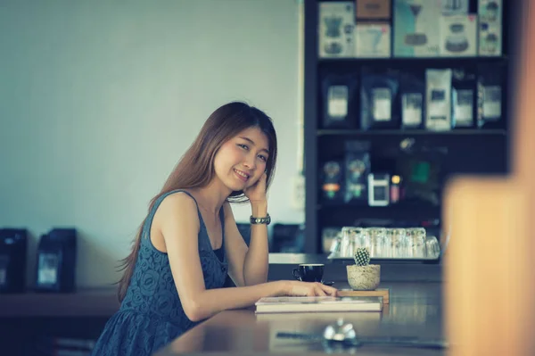 portrait of asia happy woman in cafe