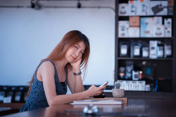 portrait of asia happy woman resting in cafe on holiday