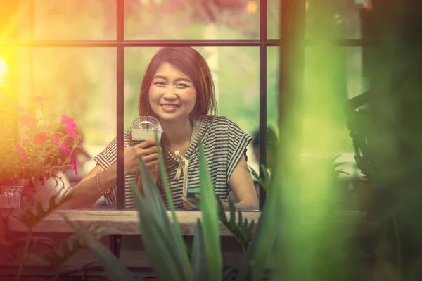 portrait of asia beautiful woman relax in coffee shop