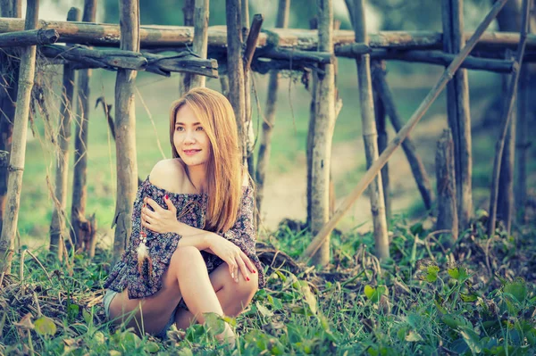 asia woman in Off  Shoulder shirt and short jeans standing on nature