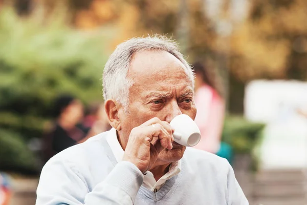 Senior man drinking coffee — Stock Photo, Image