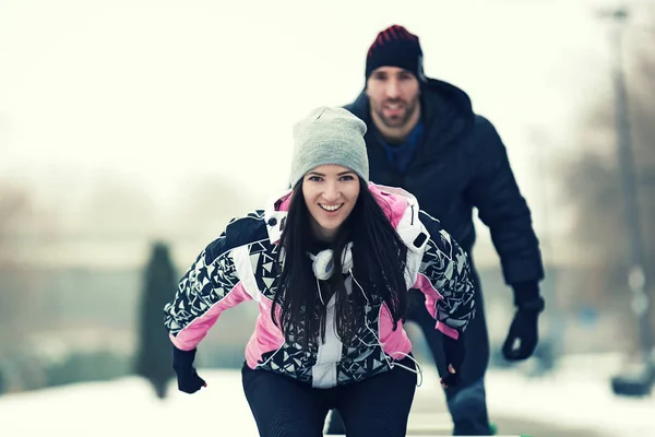Enthusiastic Love Couple Exercising Outdoors.