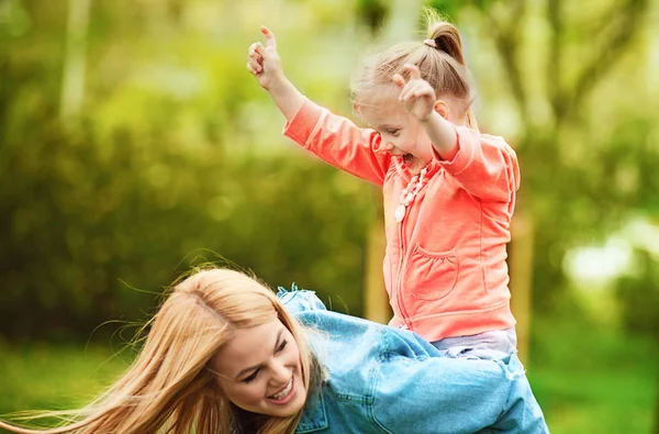 Mother and Daughter Enjoying Spring Day in the Park Stock Image