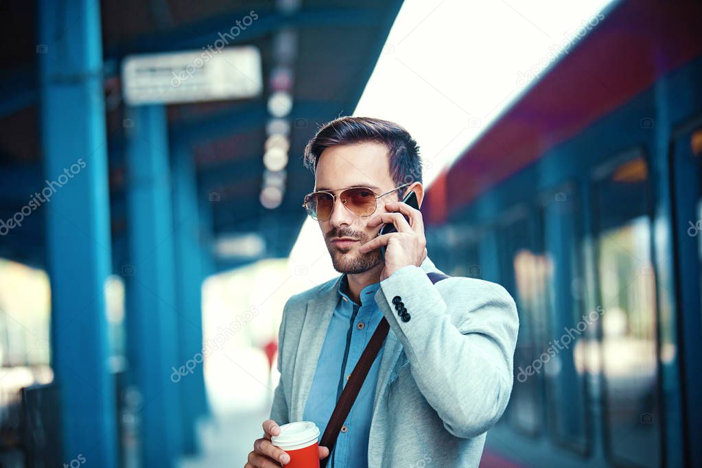 Businessman on rail station