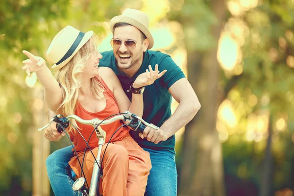 Happy Couple Riding a Bike — Stock Photo, Image