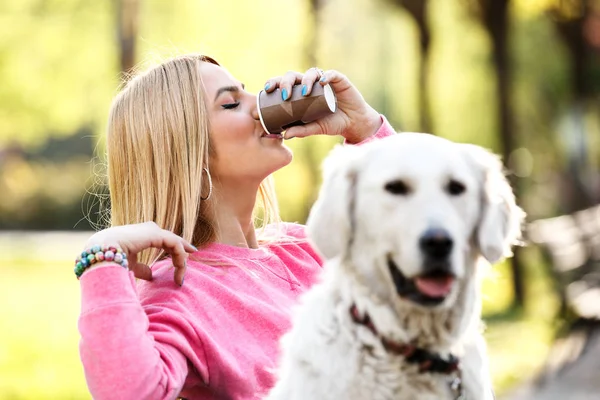 Woman enjoying park with dog — Stock Photo, Image