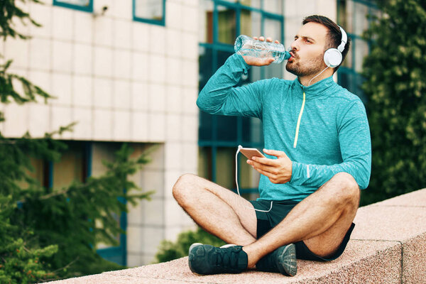Man is relaxing after jogging