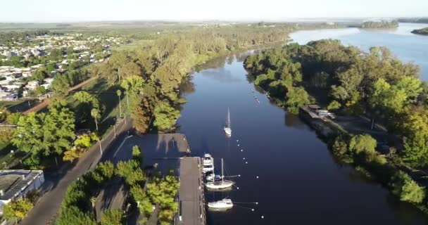 Aerial general view of waterfront park and moorings at foggy morning. Flying towards sailboat. Rio Negro, Mercedes, Soriano, Uruguay — Stock Video