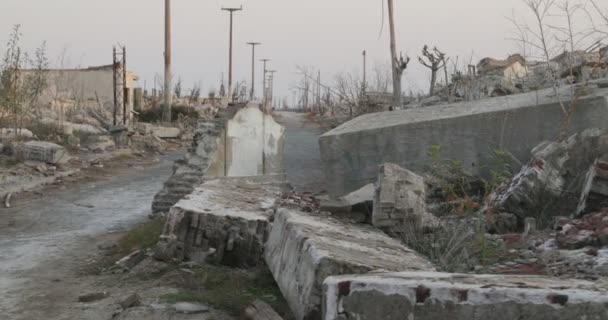 Panning through destructed and abandoned city at dawn. Traveling at street between constructions rubble of Epecuen town. Natural hazard consequences. Buenos Aires, Argentina — Stock Video