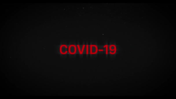 Red Covid-19 title animation with glitch effect and dust. Old tv texture and vignette. Pandemic lethal virus news. — Stock Video