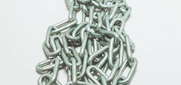Steel chain heap - abstract metal background.