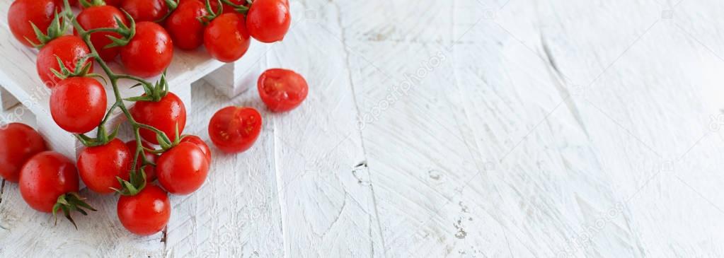 Cherry tomatoes on a white tabe