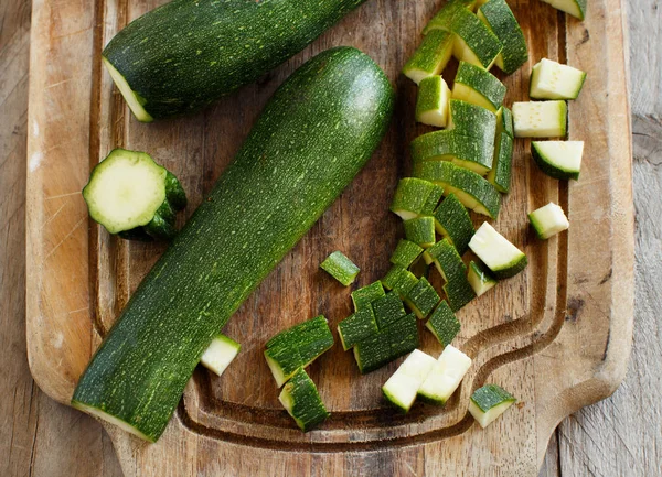 Fresh zucchini on wooden board — Stock Photo, Image