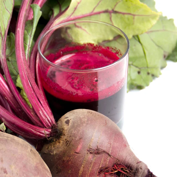 Fresh juice of red beets on white