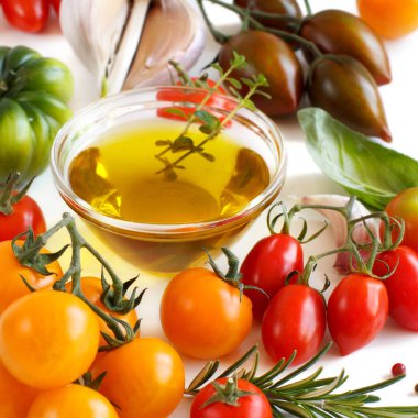 Colorful tomatoes, garlic, basil and oilve oil  clipart