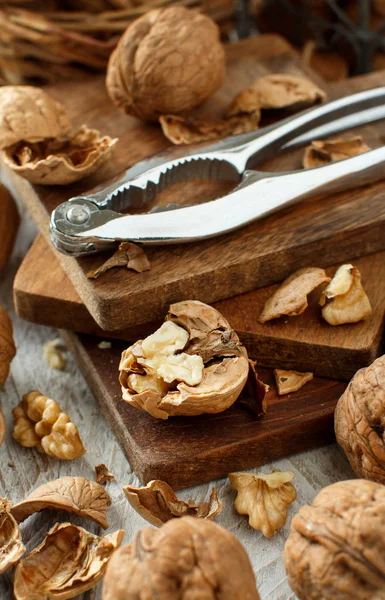 Fresh walnuts on an old wooden table — Stock Photo, Image