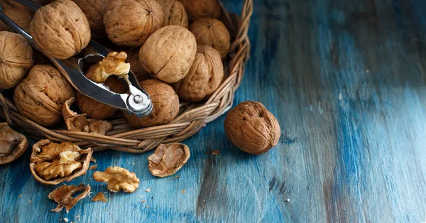 Fresh walnuts on a blue wooden table — Stock Photo, Image