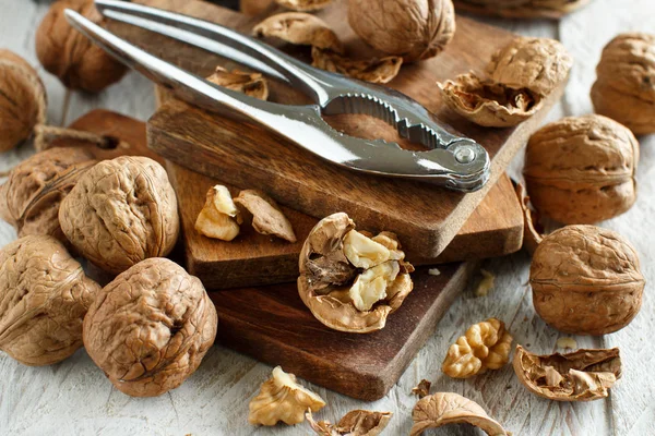 Fresh walnuts on an old wooden table — Stock Photo, Image