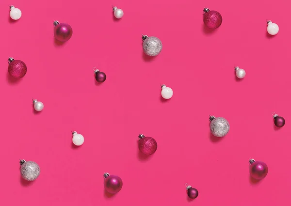 Christmas baubles on a pink background — Stock Photo, Image