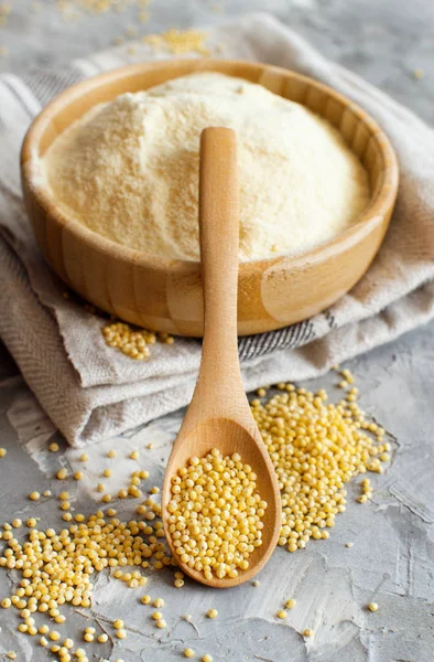 Hulled millet flour and grain in a bowl — Stock Photo, Image