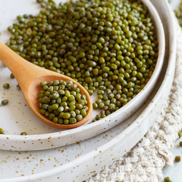 Dried mung beans on a plate with a spoon — Stock Photo, Image