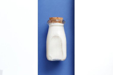 Milk on a white and blue background clipart