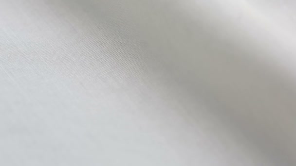 Witte katoenen stof textuur. Het kan worden gebruikt als achtergrond — Stockvideo