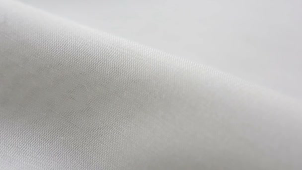 Witte katoenen stof textuur. Het kan worden gebruikt als achtergrond — Stockvideo