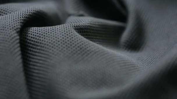 Сетчатая ткань. черная синтетическая ткань. можно использовать в качестве фона — стоковое видео