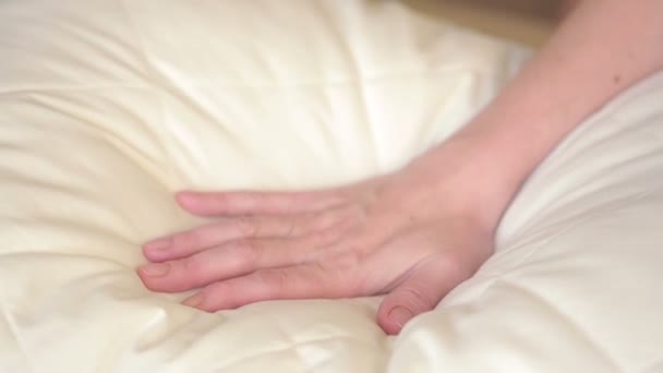 Female hand pressing on the pillow. soft pillow — Stock video