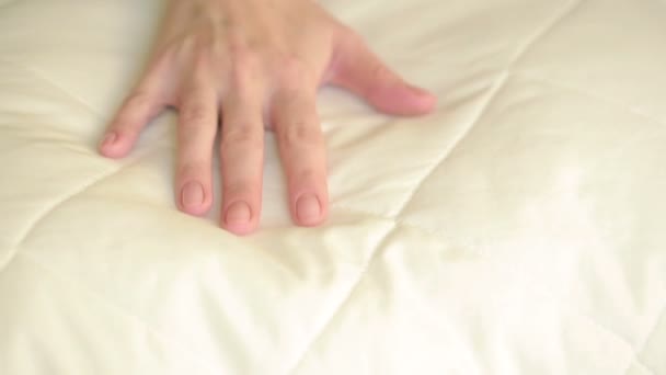 Female hand pressing on the pillow. soft pillow — Αρχείο Βίντεο