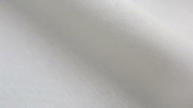 Beyaz pamuklu kumaş dokusu. Arka plan olarak kullanılabilir