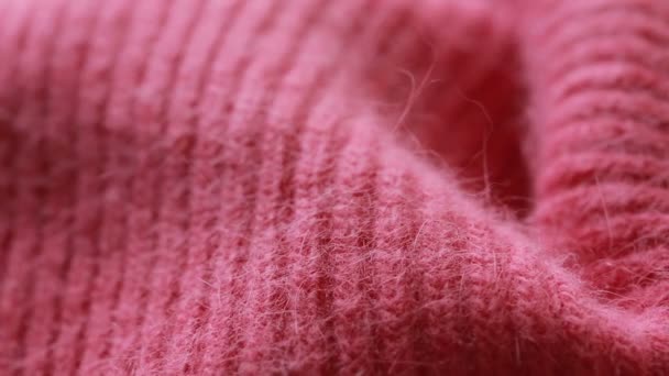 빨간색 모직 소모 사 스웨터 패턴입니다. 배경으로 사용할 수 있습니다.. — 비디오