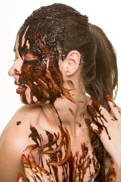 Beautiful girl bathed in chocolate — Stock Photo, Image