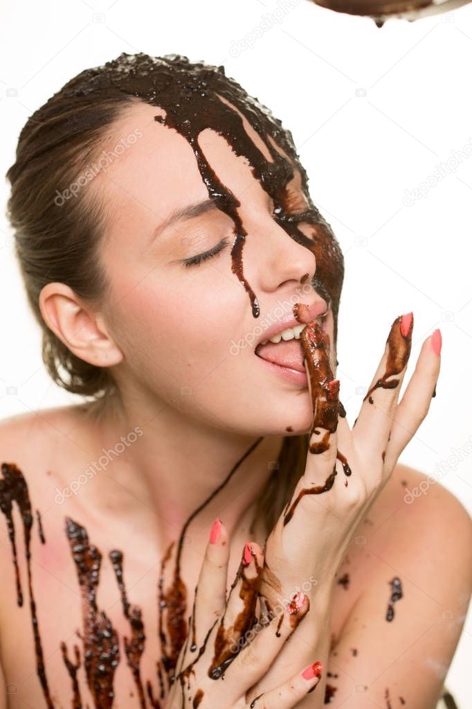 beautiful girl bathed in chocolate