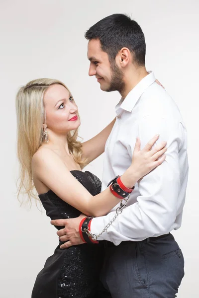 Elegant man and woman in handcuffs. couple in love — Stock Photo, Image