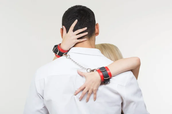 Elegant man and woman in handcuffs. couple in love — Stock Photo, Image