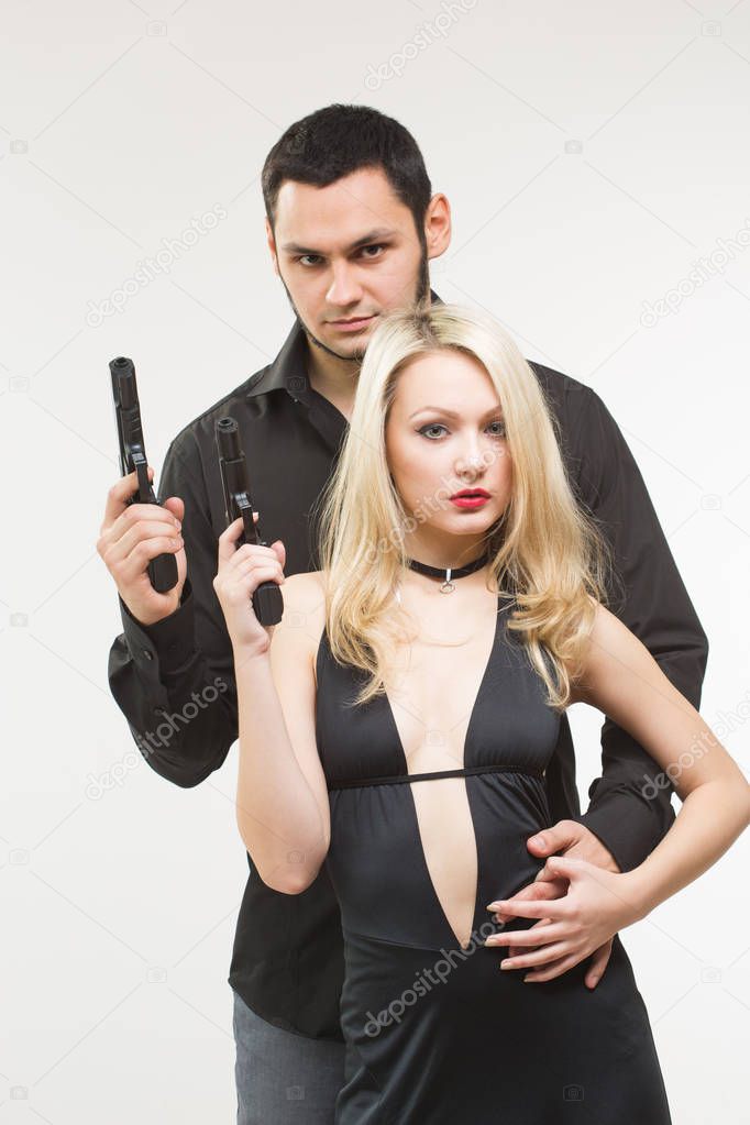 Man detective agent criminal and sexy spy woman with gun.