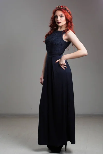 Red-haired model posing in evening dress and in diadem — Stock Photo, Image