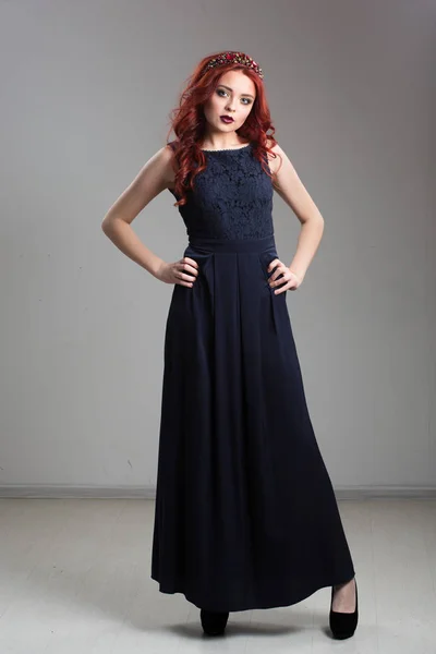 Red-haired model posing in evening dress and in diadem — Stock Photo, Image