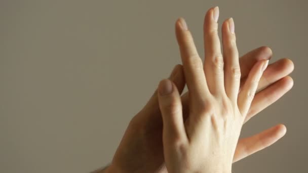 Close up man and woman hand touching holding together on blurred background. — Stock Video