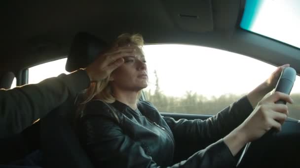 Blondie young woman driving a car — Stock Video