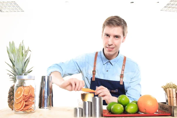 Bartender with a shaker and bottle. behind the bar — Stock Photo, Image