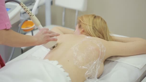 Hardware cosmetology. woman getting rf lifting procedure in a beauty parlour. — Stock Video