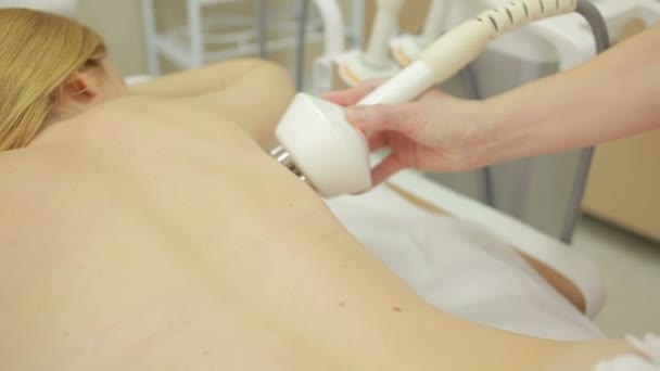 Hardware cosmetology. woman getting rf lifting procedure in a beauty parlour. — Stock Video