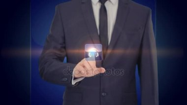 teknoloji kavramı - sanal ekranlarda kulaklık tuşuna basarak işadamı