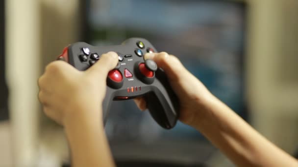 Man playing video game with a joystick. close-up of childrens hands — Stock Video