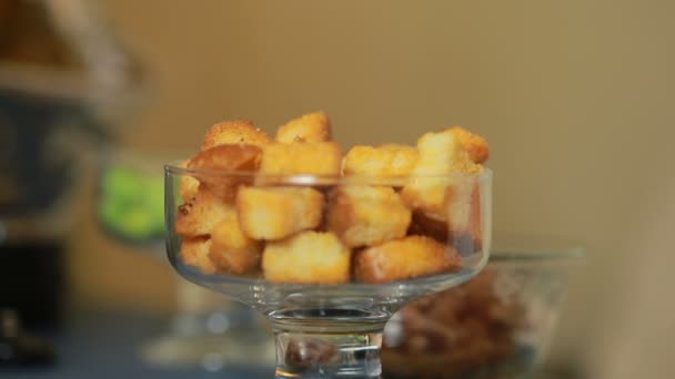 Fresh chilled glass of beer with snack crackers. mans hand takes croutons — Stock Video