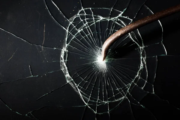 Broken glass texture. rusty crowbar — Stock Photo, Image