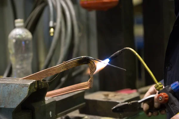 Repairing transformer and welding copper wire — Stock Photo, Image